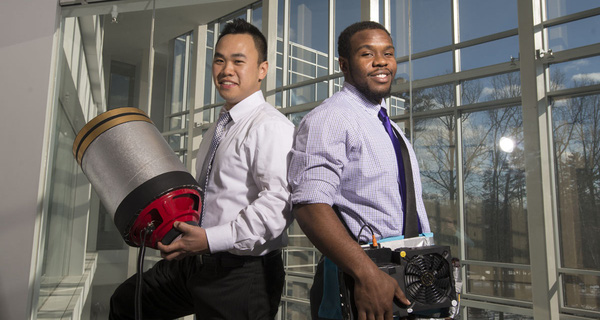 Students Viet Tran (L) and Seth Robertson with their invention, a sound extinguisher, at the Fairfax Campus. Photo by Alexis Glenn/Creative Services/George Mason University